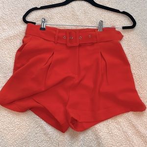 Size small orange belted with pockets shorts